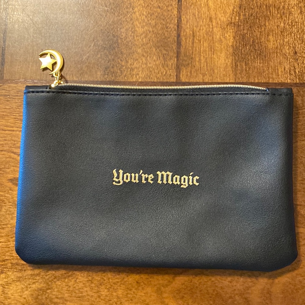 Black ispy bag with moon and star charm. Like new.